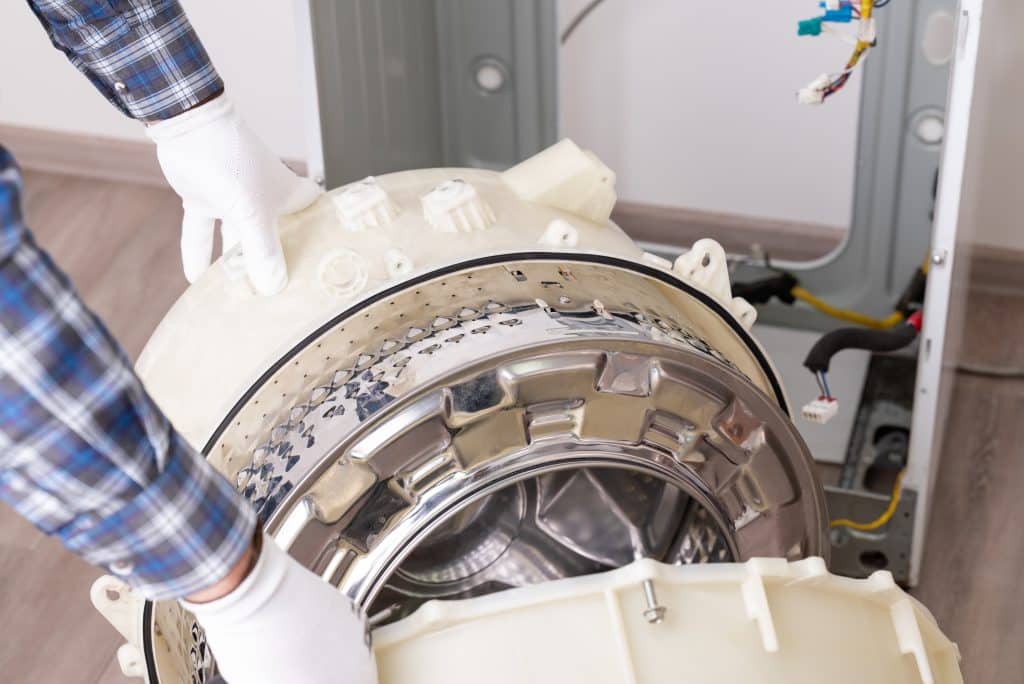 Repairing,Washer,In,Service,Centre.,Handyman,Completely,Disassembled,Washing,Machine