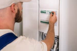 Electrician,Inspects,And,Adjusts,The,Electrical,Panel,In,A,Residential